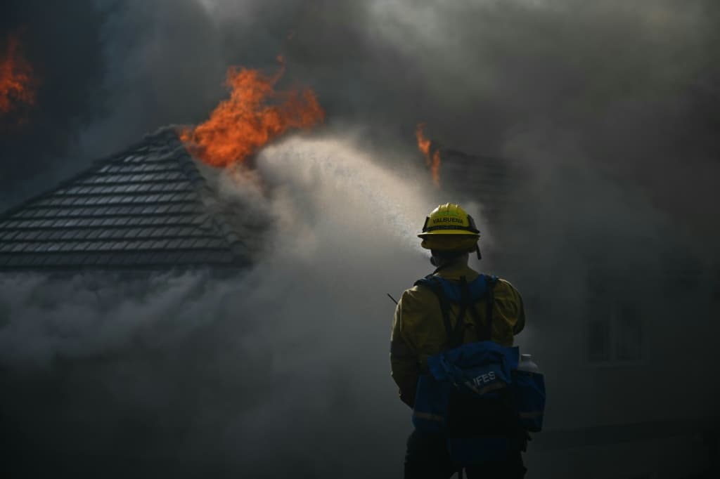Fast-spreading wildfires engulf homes in Southern California