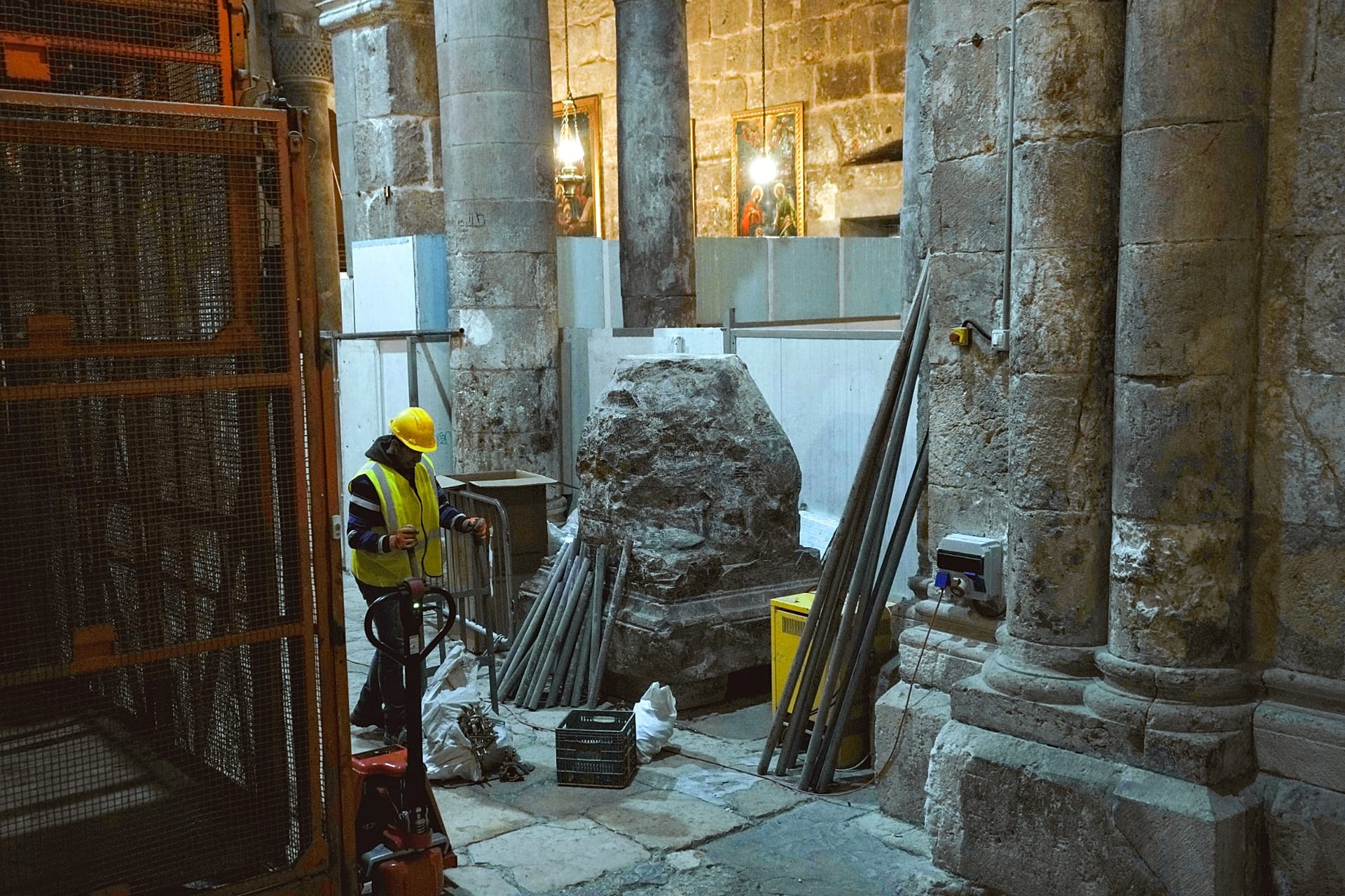 A member of the restoration team works on the floor of the Church of the Holy Sepulchre, where many Christians believe that Jesus was crucified, buried and rose from the dead.