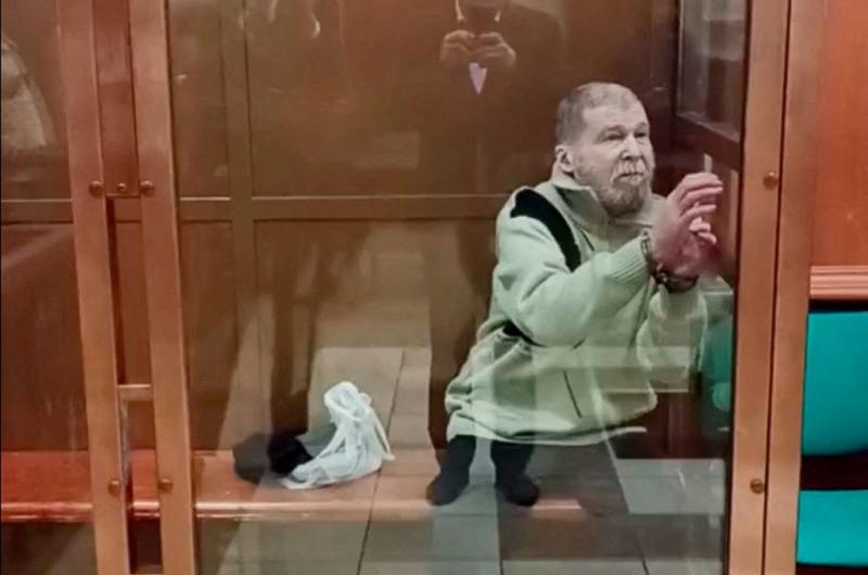A handout photo made available by Moscow's court shows US citizen Stephen Hubbard inside a glass cage during the guilty verdict announcement. Photo: 7 October 2024.