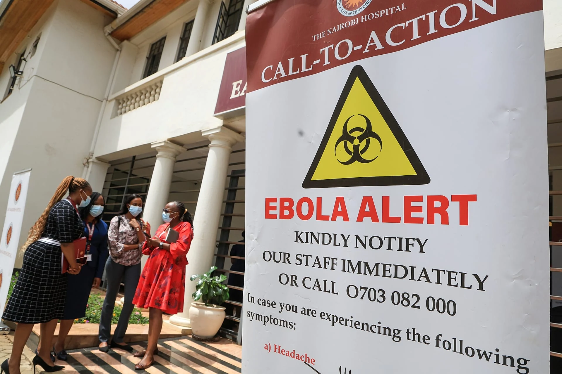 Health workers and officials stand outside a Ebola isolation facility at The Nairobi Hospital, 7 October, 2026