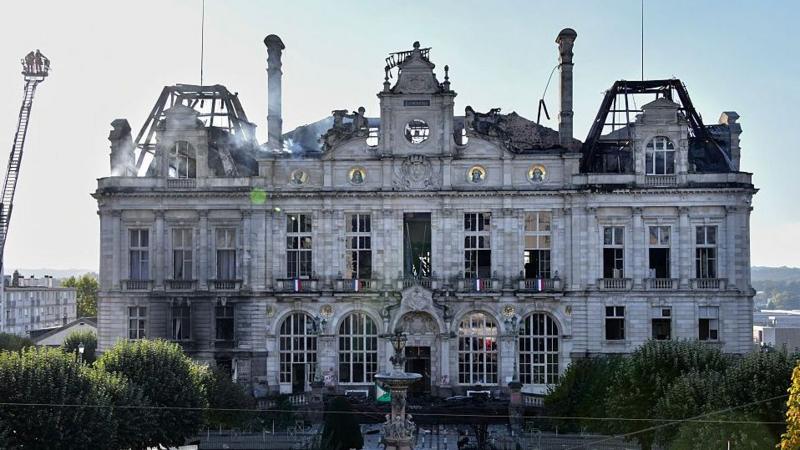 This photograph shows the partially burnt facade of the Limoges city hall a day after riot and looting following nationwide protests against the “high cost of living”, in Limoges on October 18, 2026.