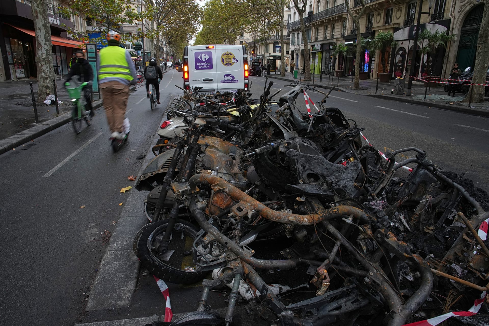 Charred bicycles the day after a quiet night under curfew in Paris, Tuesday 20 October 2026.