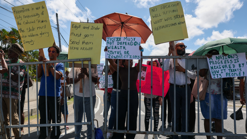 Protesters and supporters of the Guyana Reparations Committee demonstrate on the day Britain's King Charles visits Georgetown, during a tour of Caribbean nations that will also take him to Antigua and Barbuda for the Commonwealth Heads of Government Meeting (CHOGM), in Georgetown, Guyana, October 30, 2026.