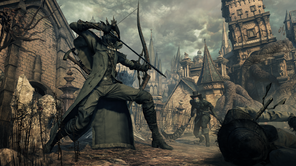 A hunter character from Bloodborne points a bow and arrow at an approaching foe, the weapon ready to release at any moment. The two appear to be in the middle of a city with European-style, gothic architecture, all spires and towers.
