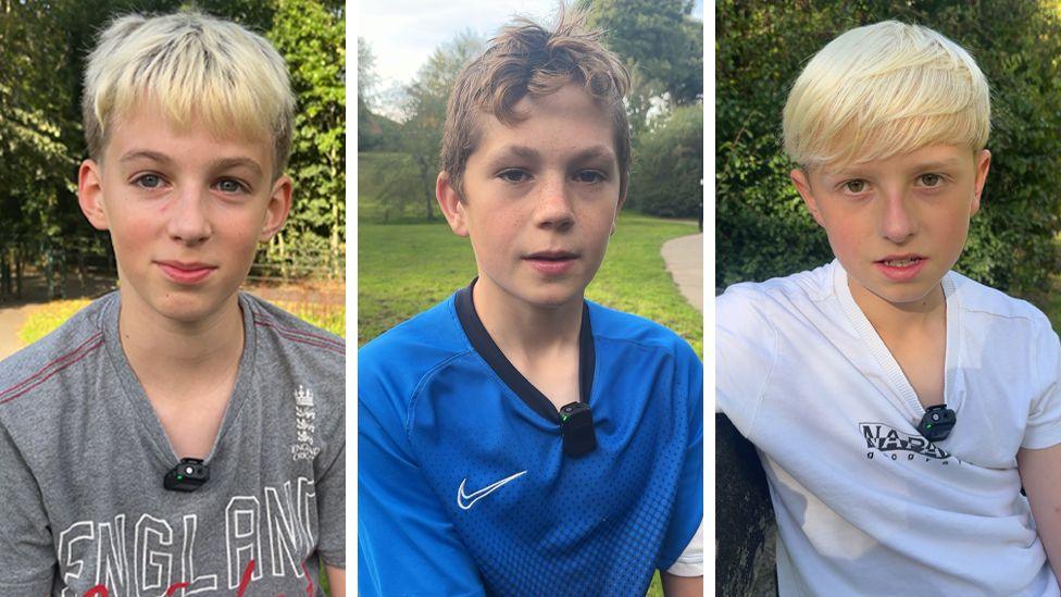 The picture is split into 3 parts. From left to right, a young boy wearing a grey England t-shirt with blonde hair is smiling at the camera. Another boy with brown hair wearing a blue Nike top is in the middle. And another blonde haired boy wearing a white t-shirt is on the right.