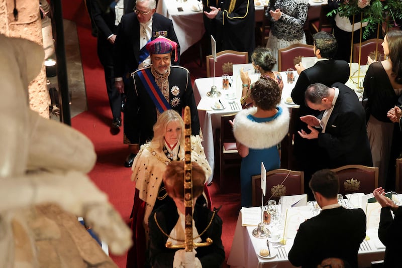 Lady Mayor Susan Langley and Oman's Sultan Haitham take their seats during a state banquet at the Guildhall in the City of London. AFP