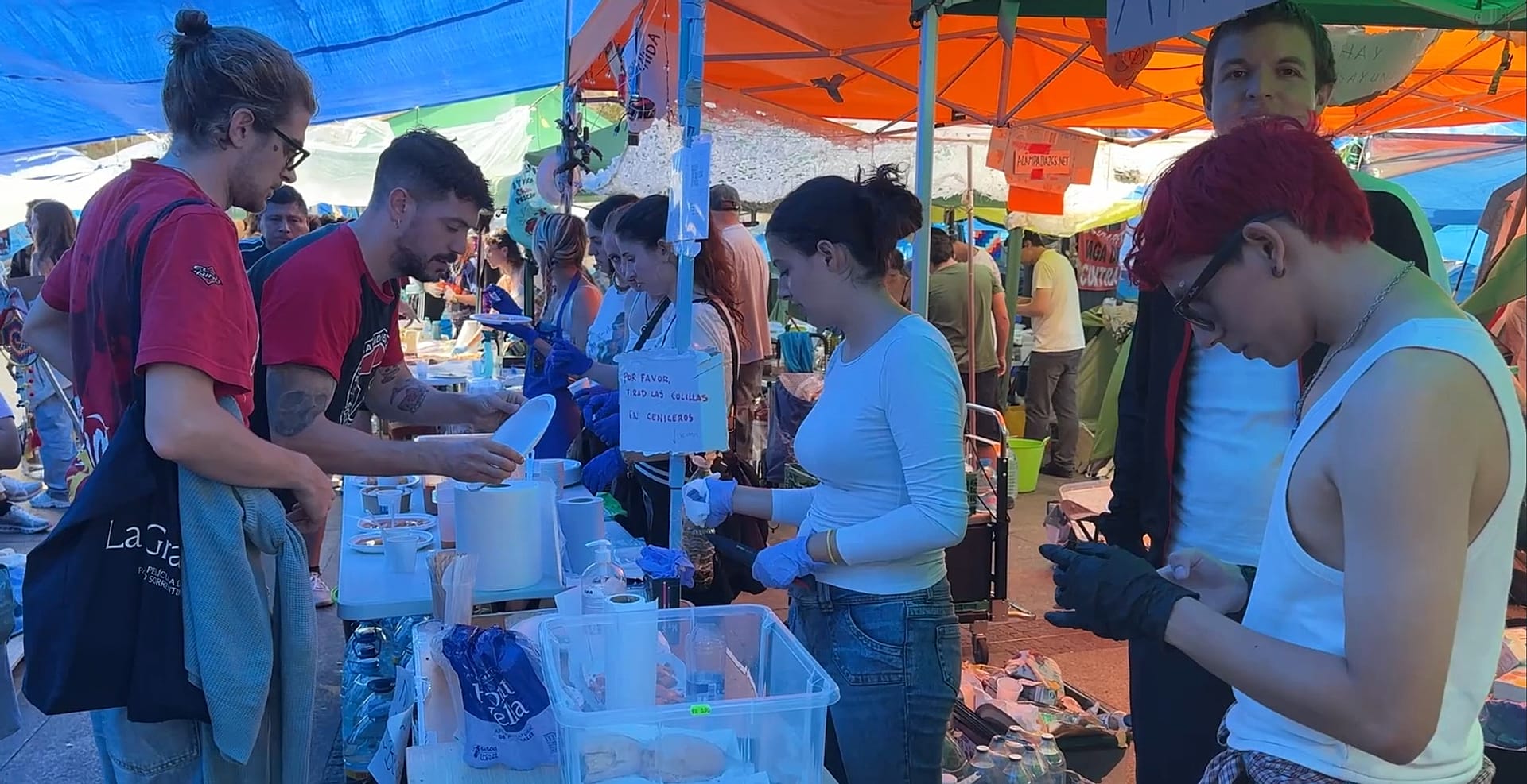 Images of food being handed out in the square.