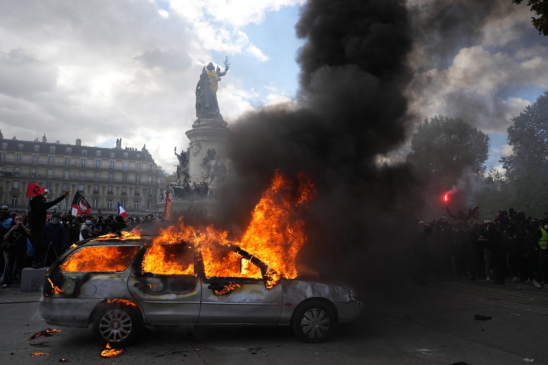 A car burns at Republique square during a protest against rising living costs, joining students' grievances, in Paris, Saturday, Oct. 17, 2026.