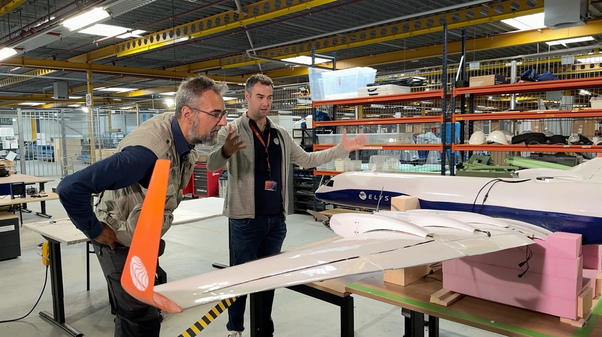 Elysian Aircraft co-founder Daniel Jacobson (on the right) explains the E9X to Euronews reporter Hans von der Brelie