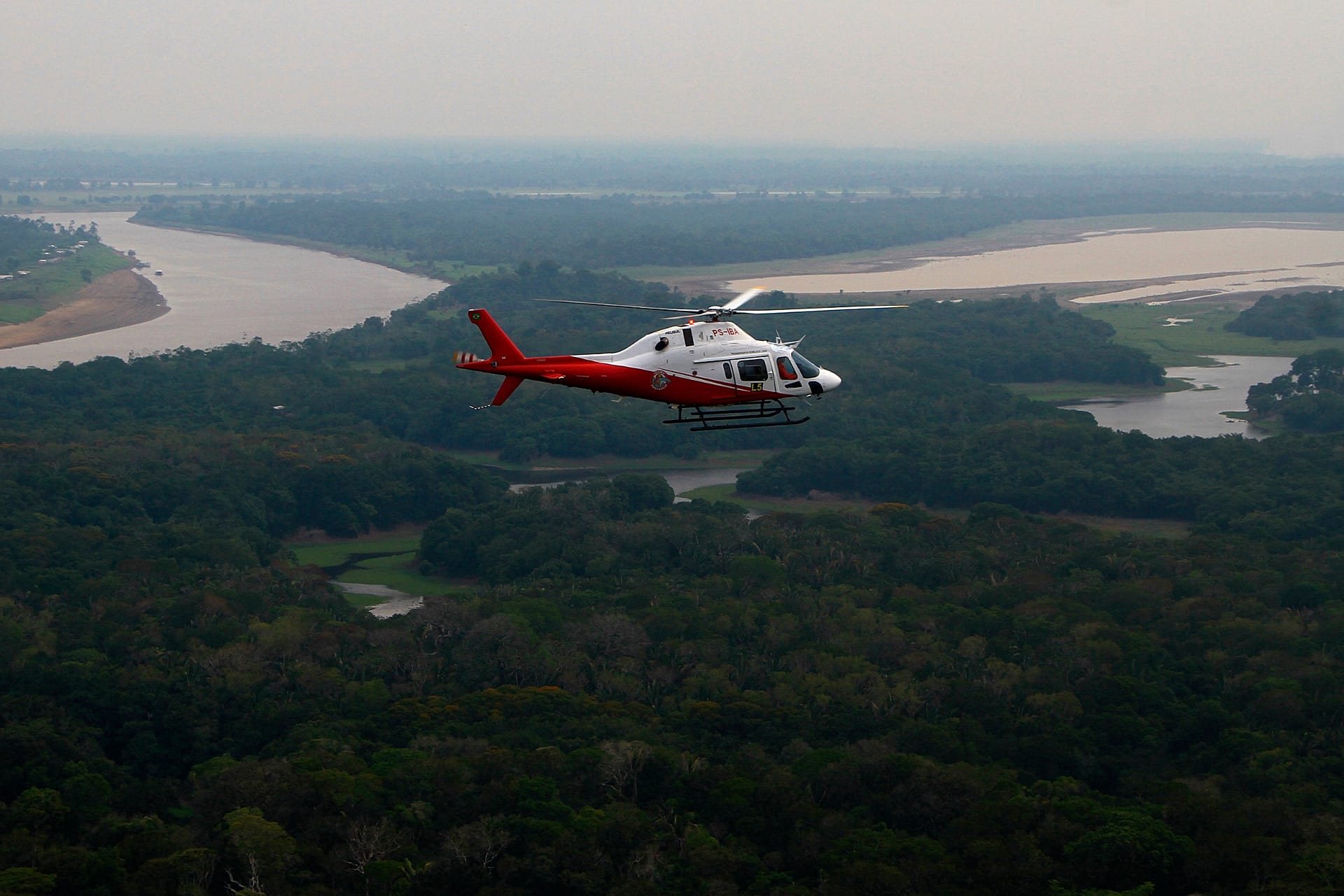 A helicopter from Brazil's environmental agency flies over an area of the Amazon during a wildfire-fighting operation in Autazes, Amazonas state, Brazil, Oct. 15, 2026. 