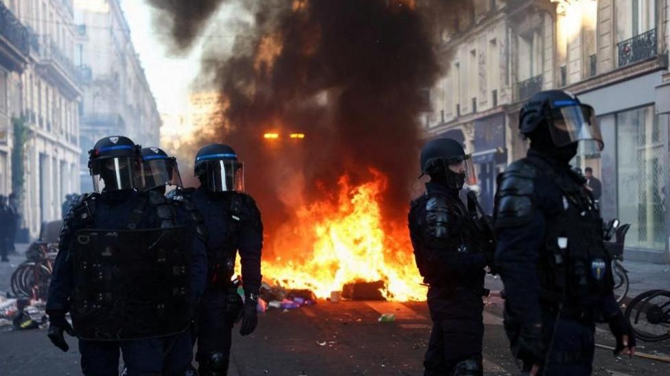 Riot police near a fire in central Paris
