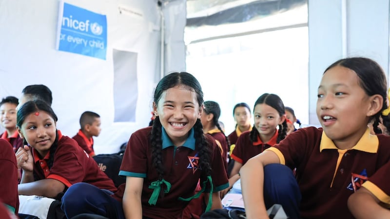 Pupils say they are happy to meet their friends in school as most have lost their homes and belongings in the devastating August floods. Photo: Rajendra Dawadi
