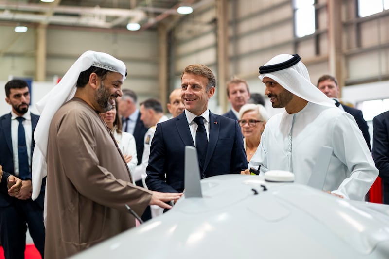 French President Emmanuel Macron with Faisal Al Bannai, adviser to President Sheikh Mohamed for strategic research and advanced technology affairs, at Tawazun Industrial Park in Abu Dhabi. UAE Presidential Court UAE Presidential Court