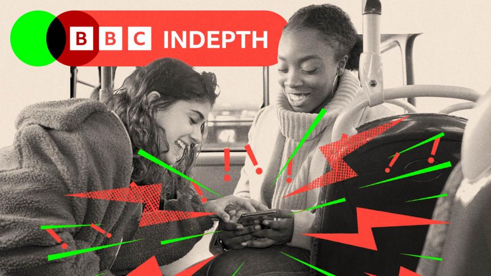 Two teenage girls laugh as they look at a phone together. One wears a wite polo neck jumper and the other wears a darker fleece. The image is black and white and there are lightning bolts and exclamation marks coming out of the phone