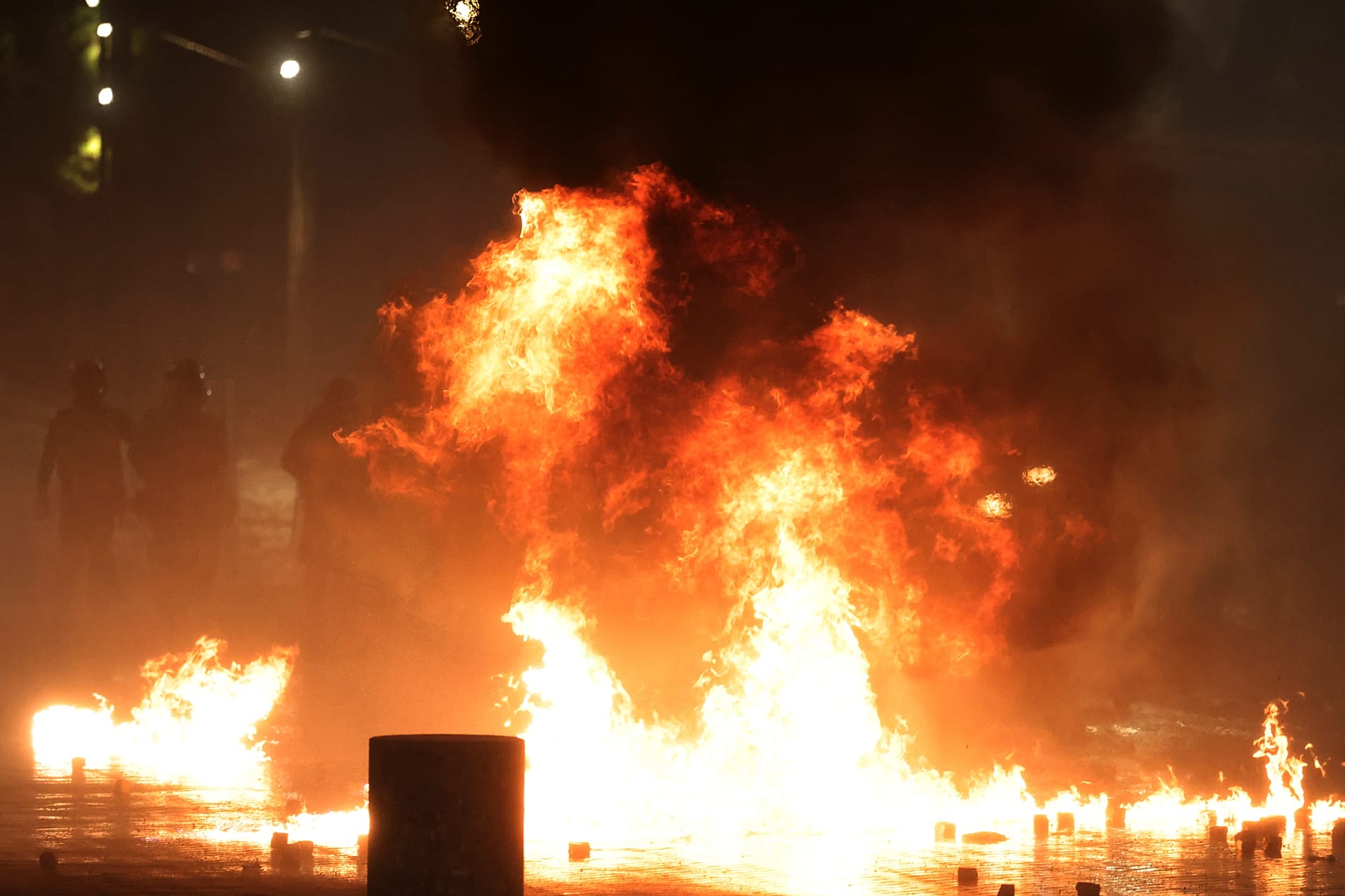 Protesters throw petrol bombs at police during clashes at an anti-government demonstration in Tirana, 18 October, 2026