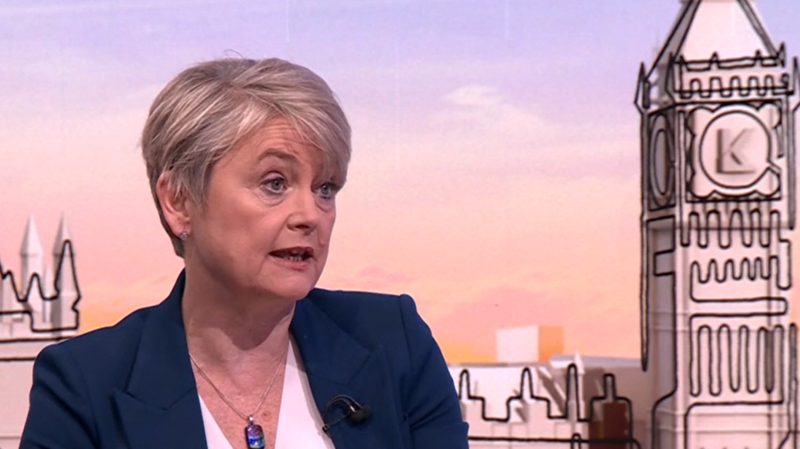 Yvette Cooper wearing a dark blue jacket and a white blouse 