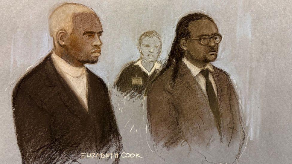 Court artist sketch by Elizabeth Cook of Chris Brown appearing in the dock alongside Omololu Akinlolu (right) at Southwark Crown Court, London, for sentencing after they pleaded guilty to affray following a bottle attack on Abraham Diaw in February 2023. Both are wearing dark suits.