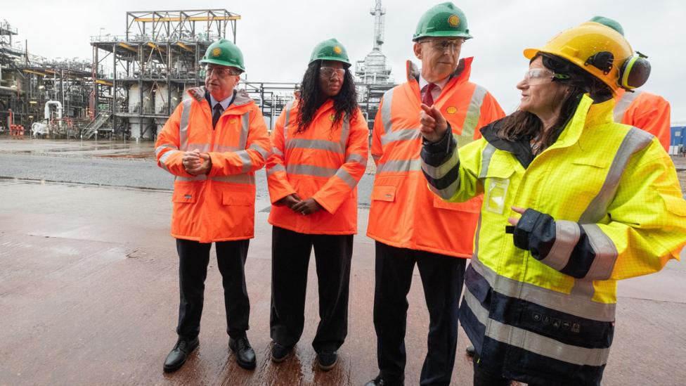 Scottish Secretary Douglas Alexander, Energy Secretary Miatta Fahnbulleh and Chancellor John Healey during a visit to Shell UK's St Fergus Gas Terminal in Aberdeenshire