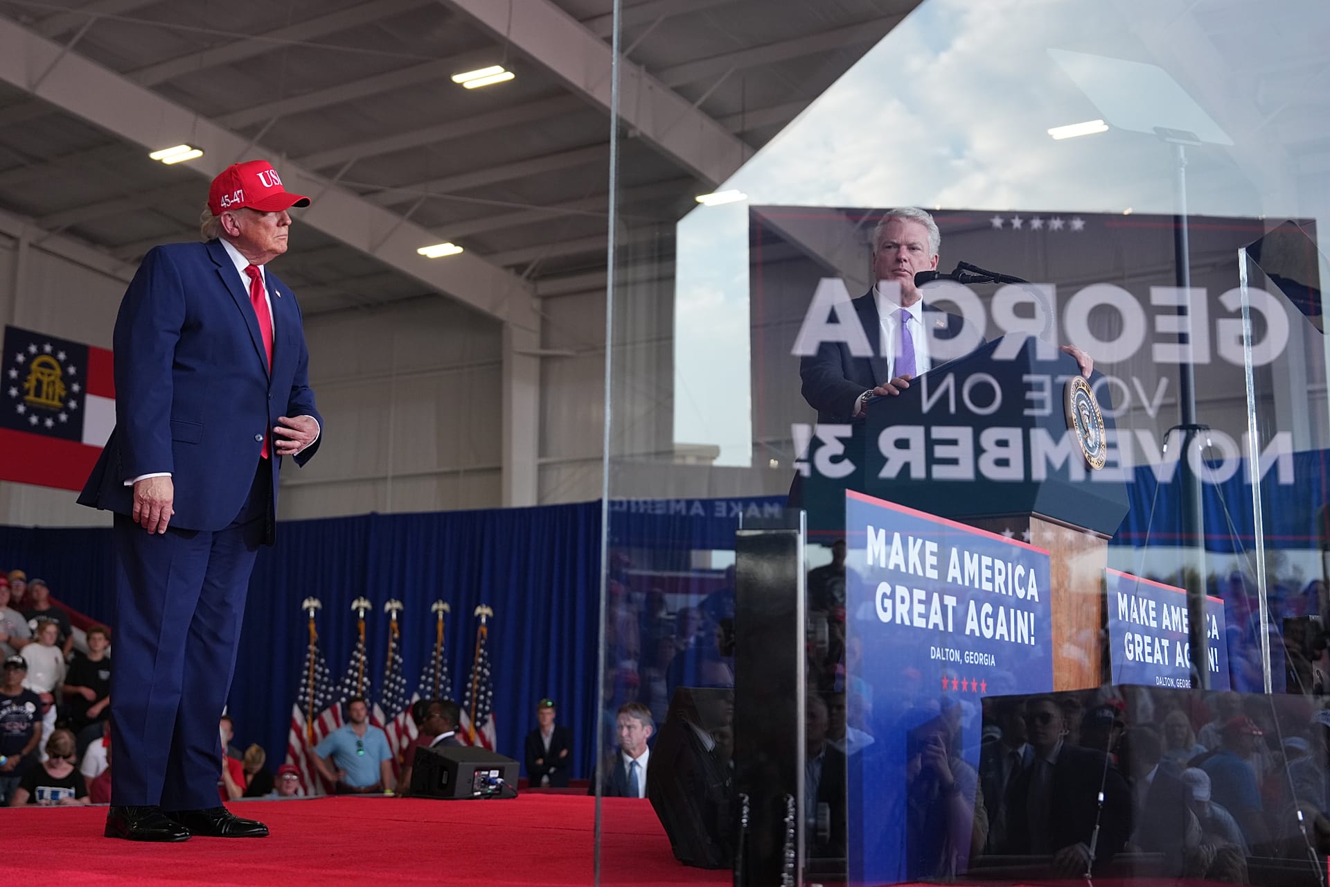 US President Donald Trump listens to Senate candidate Mike Collins at a campaign rally in Dalton, Georgia, on 16 October 2026.