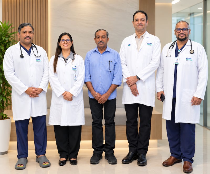 Pulmonologist Dr Jolsana Augustine, second left, with patient Unnikrishnan Sivaraman, centre, and members of the medical team. Photo: Aster DM Healthcare