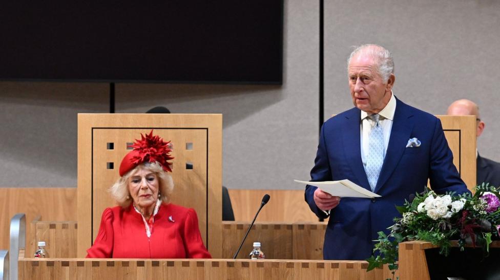 The King addressing the Senedd with Queen Camilla seated to his right.