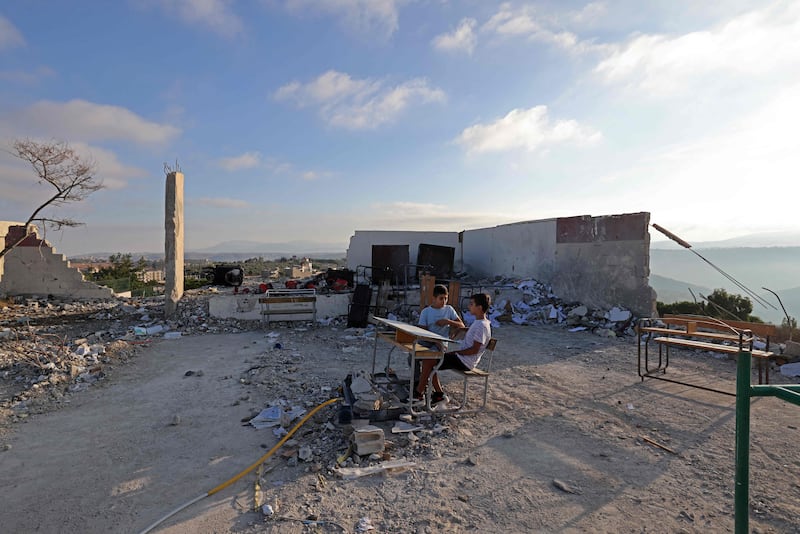 Janubiy Livonda Isroil zarbasi tushgan maktab. AFP
