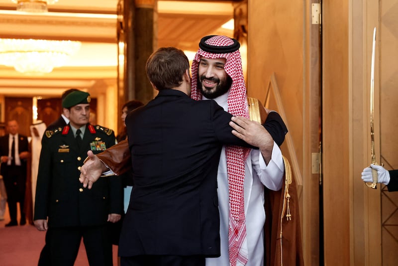 Saudi Crown Prince Mohammed bin Salman embraces French President Emmanuel Macron after a meeting at Al Yamamah Palace in Riyadh. AFP