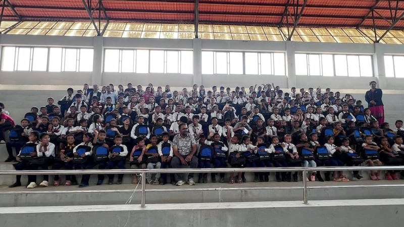 Children cheer and clap when classes resumed on September 21 in a sports academy and in tents. Photo: Rajendra Dawadi
