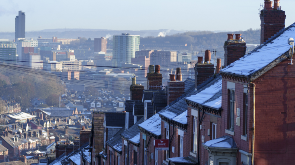 A view of ice and snow on rooftops of terraced houses in Sheffield