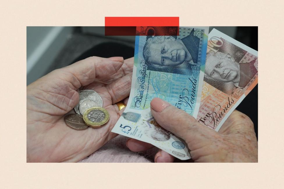 A pair of hands holding money. There are £5 and £10 notes and a couple of coins including pounds and 50 pence pieces.