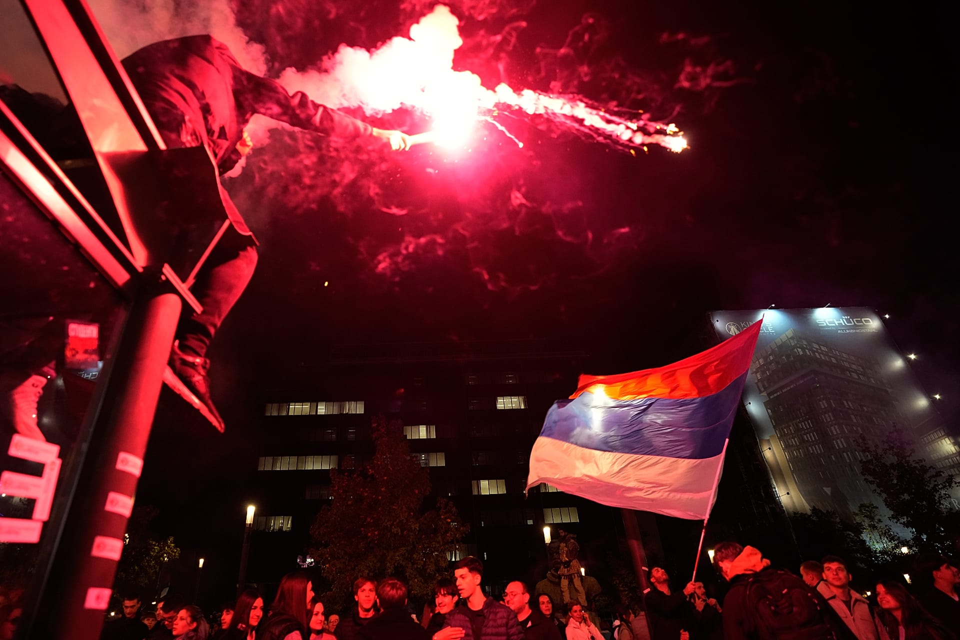 People celebrate in Belgrade, Serbia, on 26 October 2026, a day after the student-led opposition defeated Aleksandar Vucic's ruling party in parliamentary elections.