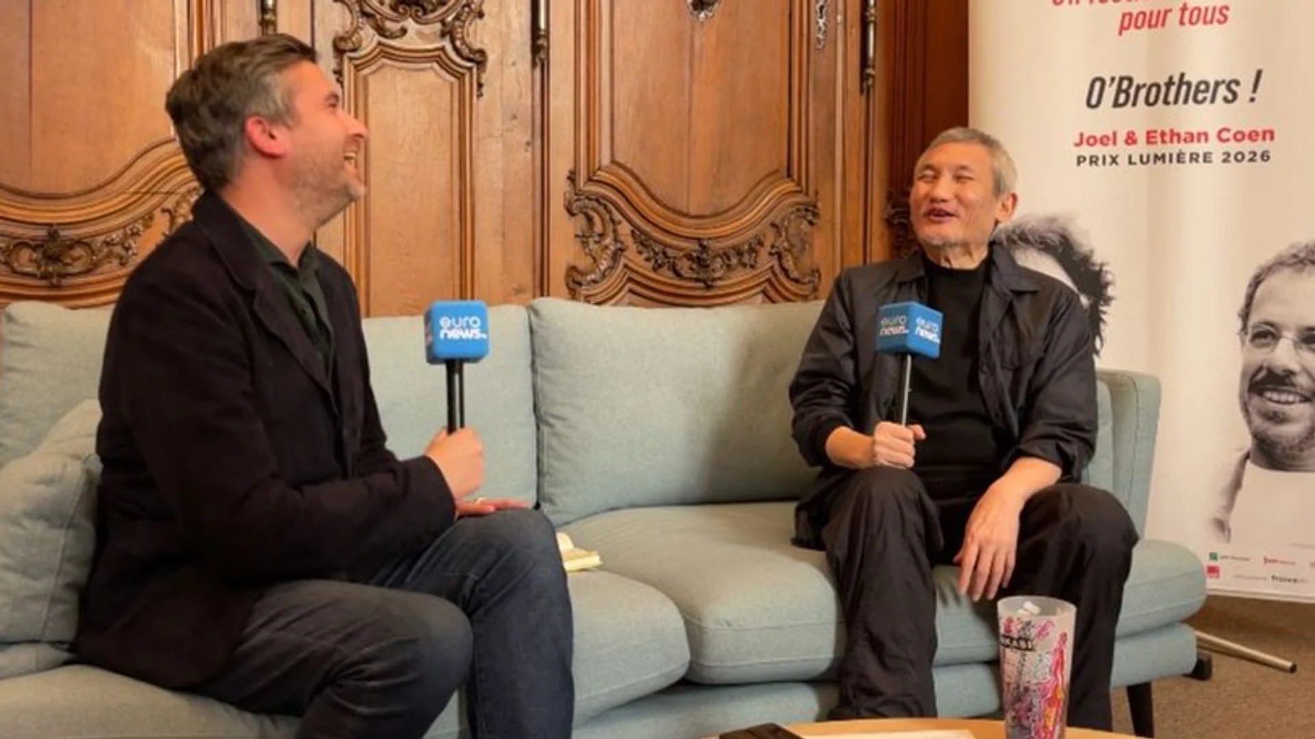 Euronews Culture's David Mouriquand with director Tsui Hark
