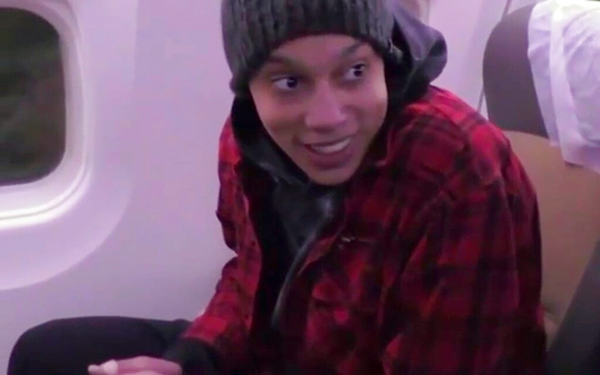Brittney Griner sits in a plane on her way to Abu Dhabi, where she is to be exchanged for Russian national Viktor Bout, in Russia, Friday 9 December 2022.