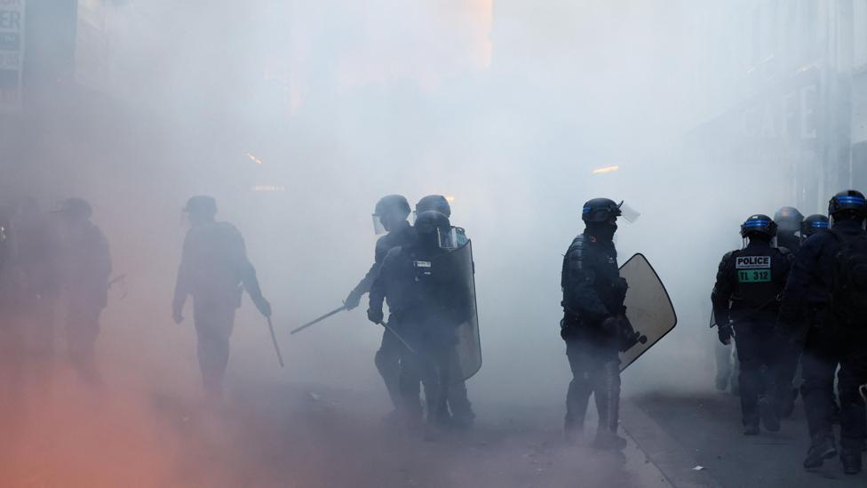 Riot police operate during civil unrest, the day after a national day of demonstrations against the cost of living and rising fuel prices, in Paris, France, October 18, 2026.